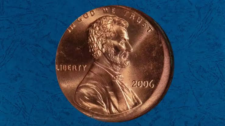 2006 penny off-center strike error showing blank crescent area with design shifted off-center